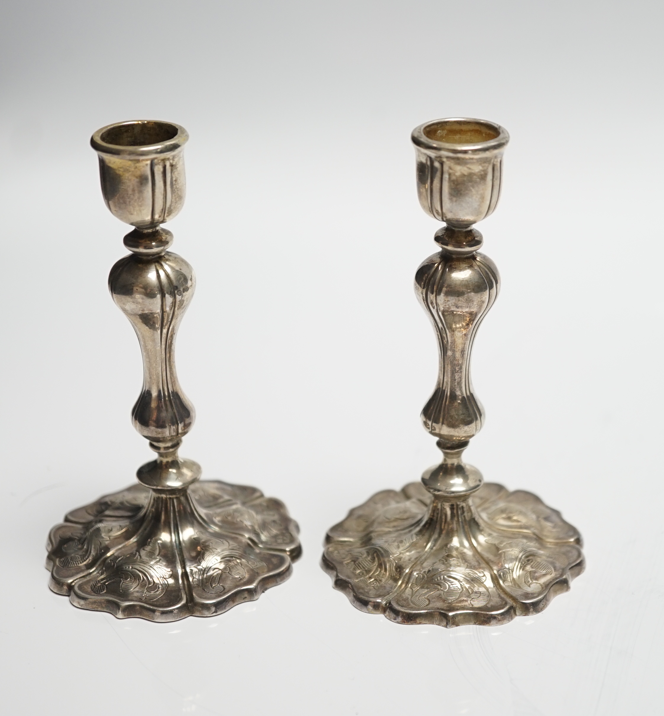 A pair of Victorian engraved silver taper sticks, by Hawksworth, Eyre & Co, Sheffield, 1848, 10.7cm, 97 grams.